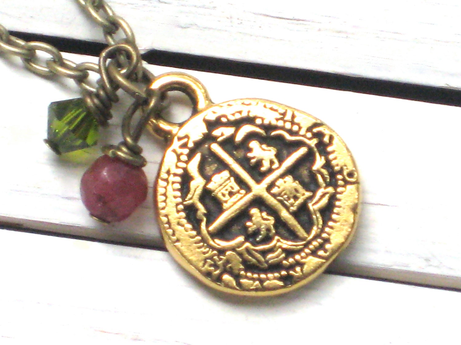 Tiny Gold Pirate Pieces of Eight Replica Necklace with Genuine Ruby and Green Crystal