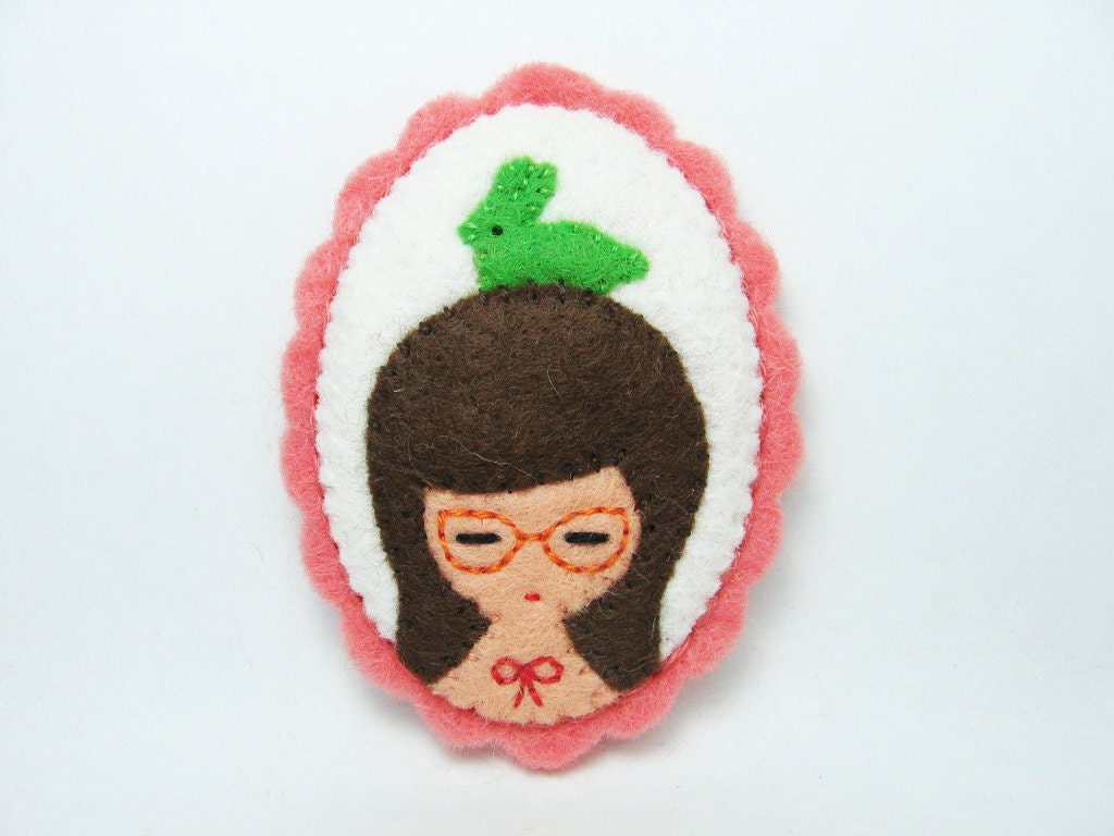 A girl and her candy rabbit felt pin