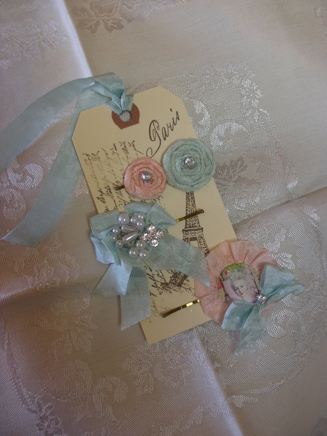 A Trio of Marie Antoinette Style Bobby Pins with Pearls Rhinestones and Vintage Ribbons on a French Inspired Gift Tag Set Three