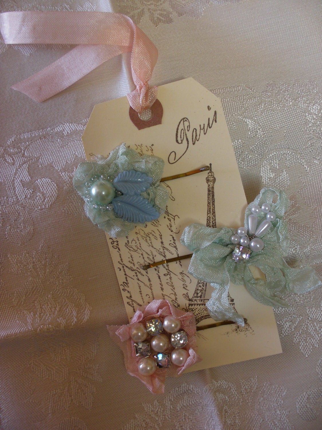 A Trio of Marie Antoinette Style Bobby Pins with Pearls Rhinestones and Vintage Ribbons on a French Inspired Gift Tag Set Four