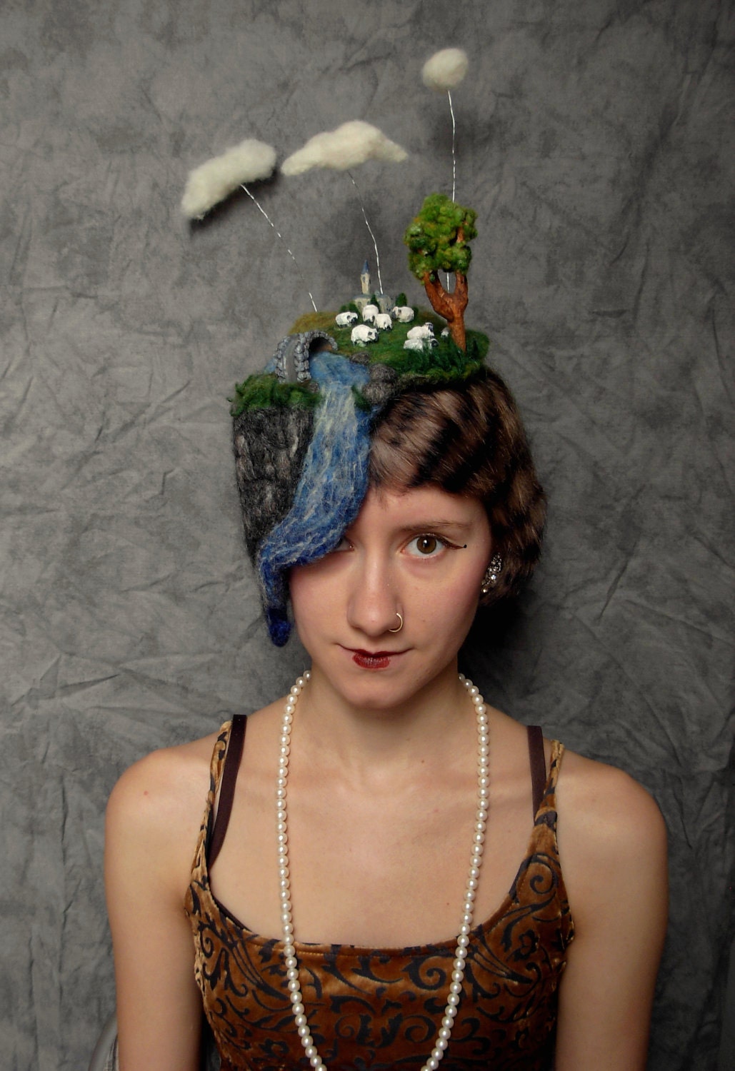 Needle Felted Hat -- Miniature Landscape of clouds, sheep grazing, chapel, river, and bridge hand carved out of wood