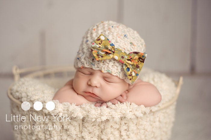Newborn beanie with color specks and bow,