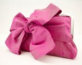 Pink bow detail clutch bag