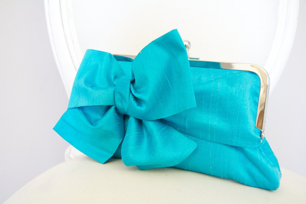 Turquoise bow clutch bag