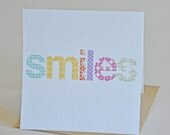 Single, square card with envelope. Smiles. Blank inside.