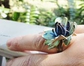 handmade upcycled adjustable  ring made from a very old vintage  flower earring