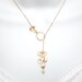 Gold Orchid Necklace, Lariat Flower Necklace with gold twisted circle