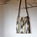 Ethnic pattern printed purse in green, red, yellow with leather strap