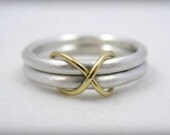 infinity wedding ring or commitment ring in sterling silver and 18 karat gold