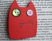 Red monster brooch