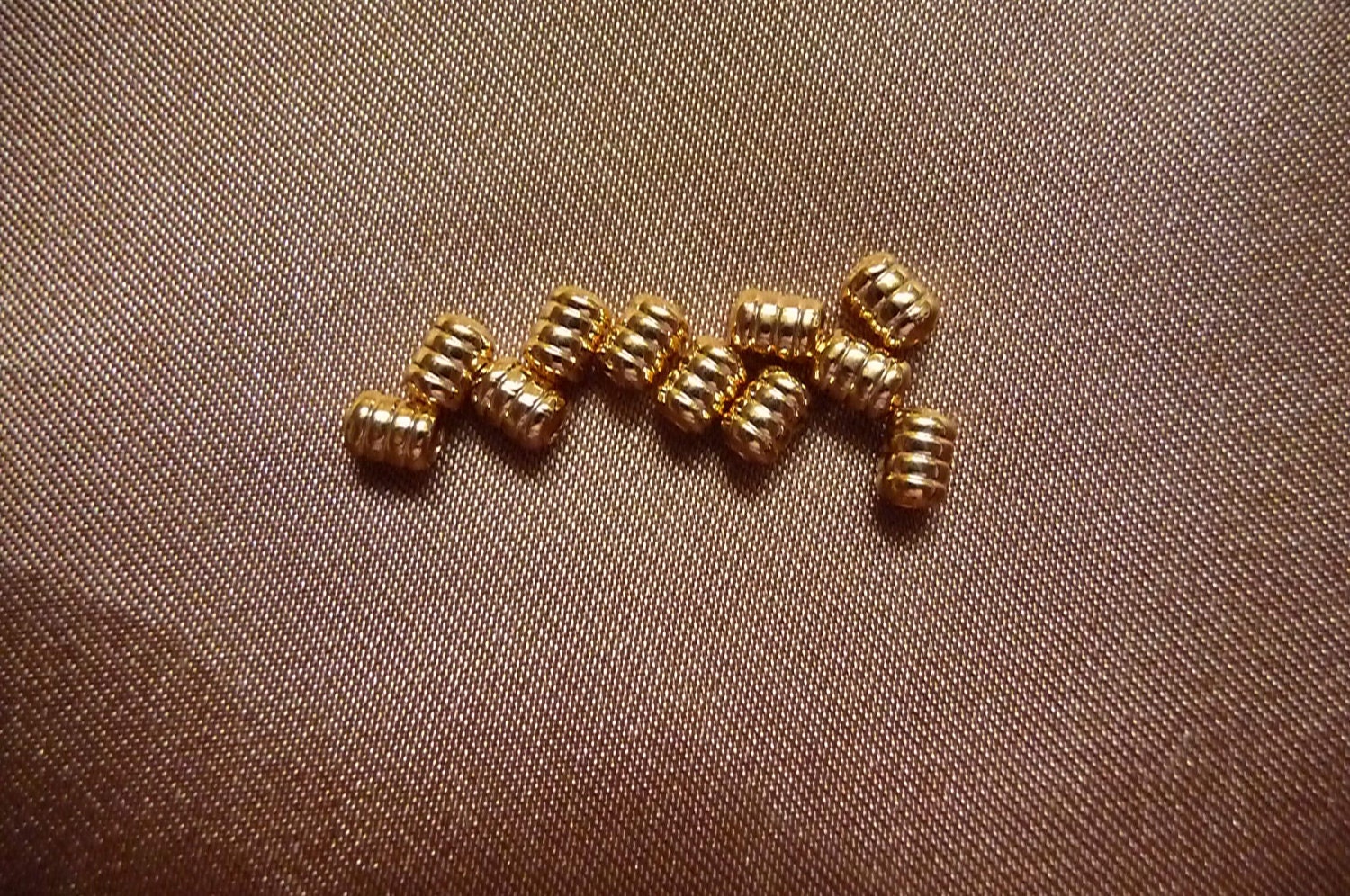 Bead, gold plated brass, 5x4mm, ribbed barrel, Pkg Of 24