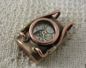 Steampunk style pendant. Brass, copper, glass and watch parts. Fully waterproof.