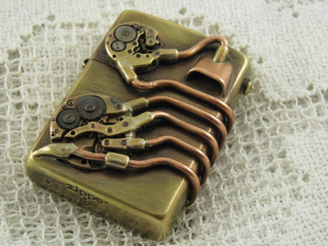 Steampunk modified Zippo windproof lighter. Made with brass, copper and vintage watch parts.