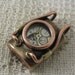 Steampunk style pendant. Brass, copper, glass and watch parts. Fully waterproof.