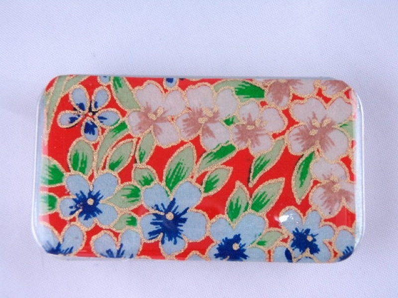 Blue and Ivory Flowers on Gorgeous Orange- Stash your secrets in this cool small slider tin - Resin protected Chiyogami top