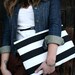 Oversized Black and white striped zippered clutch.