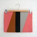 Angled clutch. Salmon pink.