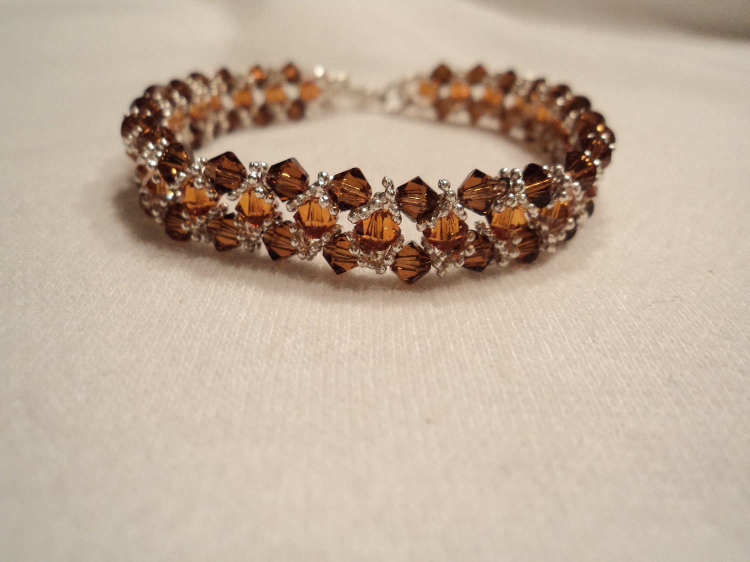 Smoked topaz and crystal copper swarovski crystal bracelet with daisy spacer
