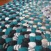 OOAK Braided Wool Rug in shades of green with blue accents made from vintage wool