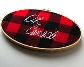 Oh Canada embroidered red and black flannel wooden hoop wall hanging 5x9 oval