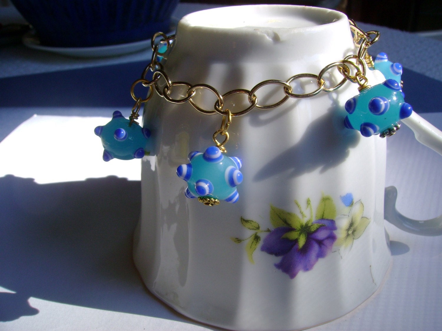 Charm Bracelet, Blue lampwork bumpy beads, Chain -Aqua Sputnik