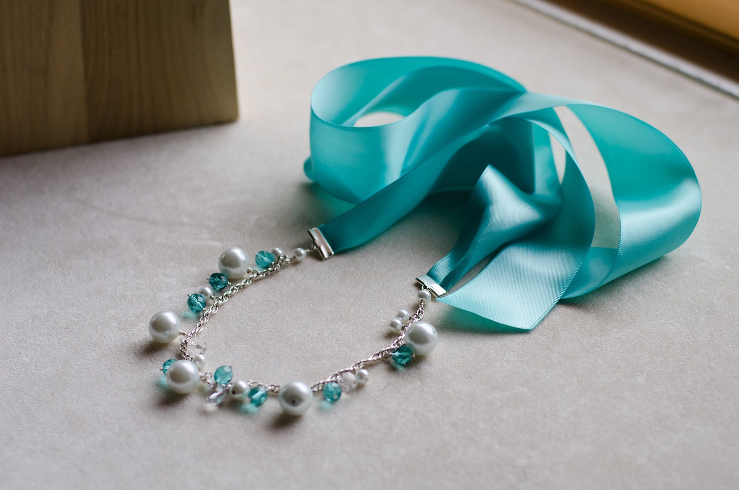 Chunky white pearl and teal ribbon necklace
