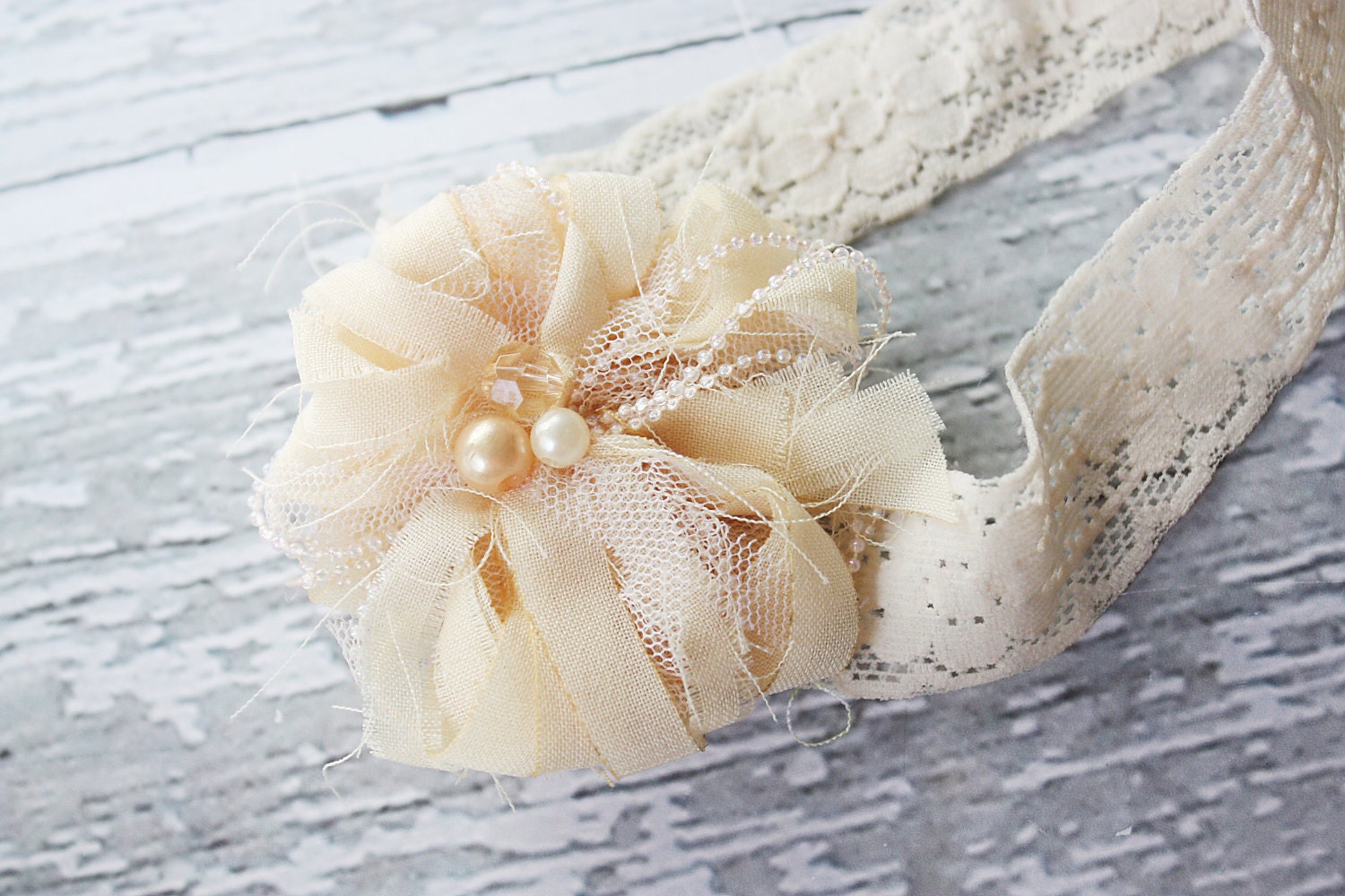 Bit of Vintage- frayed fabric flower on lace elastic with bead accents