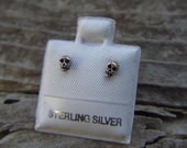 Small skull stud earrings in sterling silver