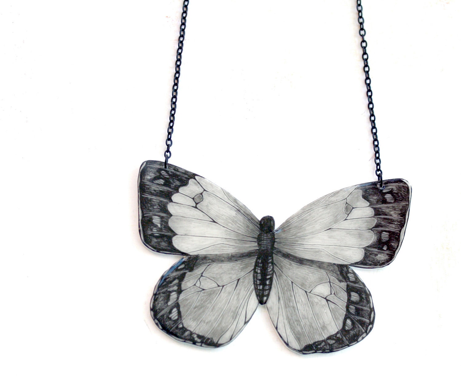 Butterfly II necklace -pendant, drawing on plastic