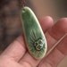 Awakening - A unique porcelain pendant in green.