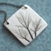 Earthy Porcelain Pendant with Impression of small leaves.