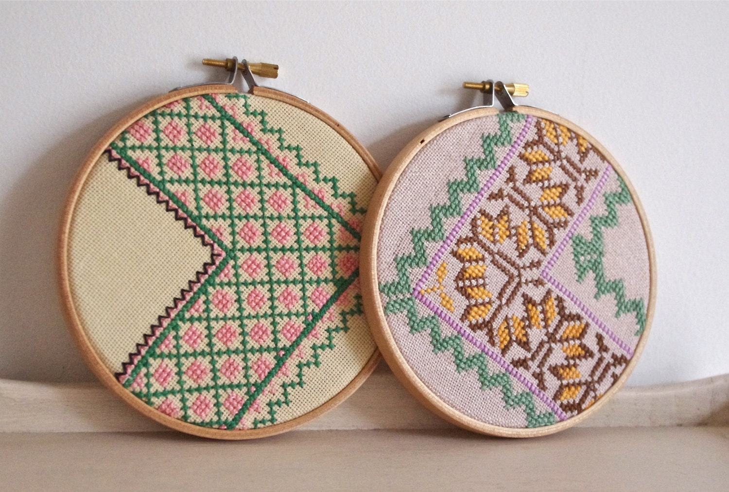 Pair of vintage embroidered zig zag wall art hoops