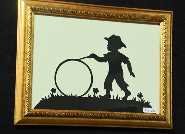 Boy With Wheel - Scherenschnitte - Hand Paper Cutting Art signed and dated By Janet Lynch -5x7 Framed
