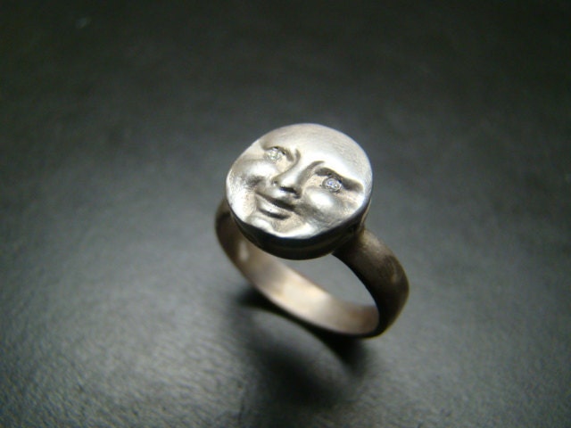 Sterling Silver moonface / sunface ring with diamond eyes.