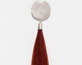 Sterling Silver Disk with Long Red Human Hair Lock