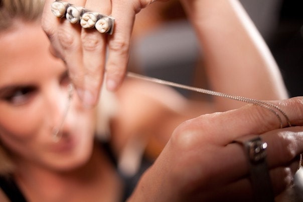 Sterling Silver and Four Human Teeth Knuckle Ring