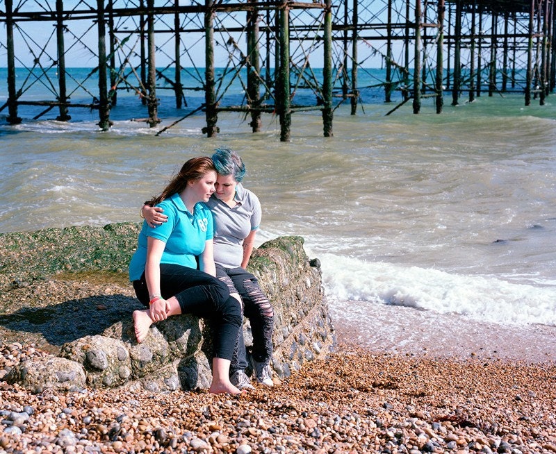 Cara and Daisy Under the Pier, Brighton, England.  2010