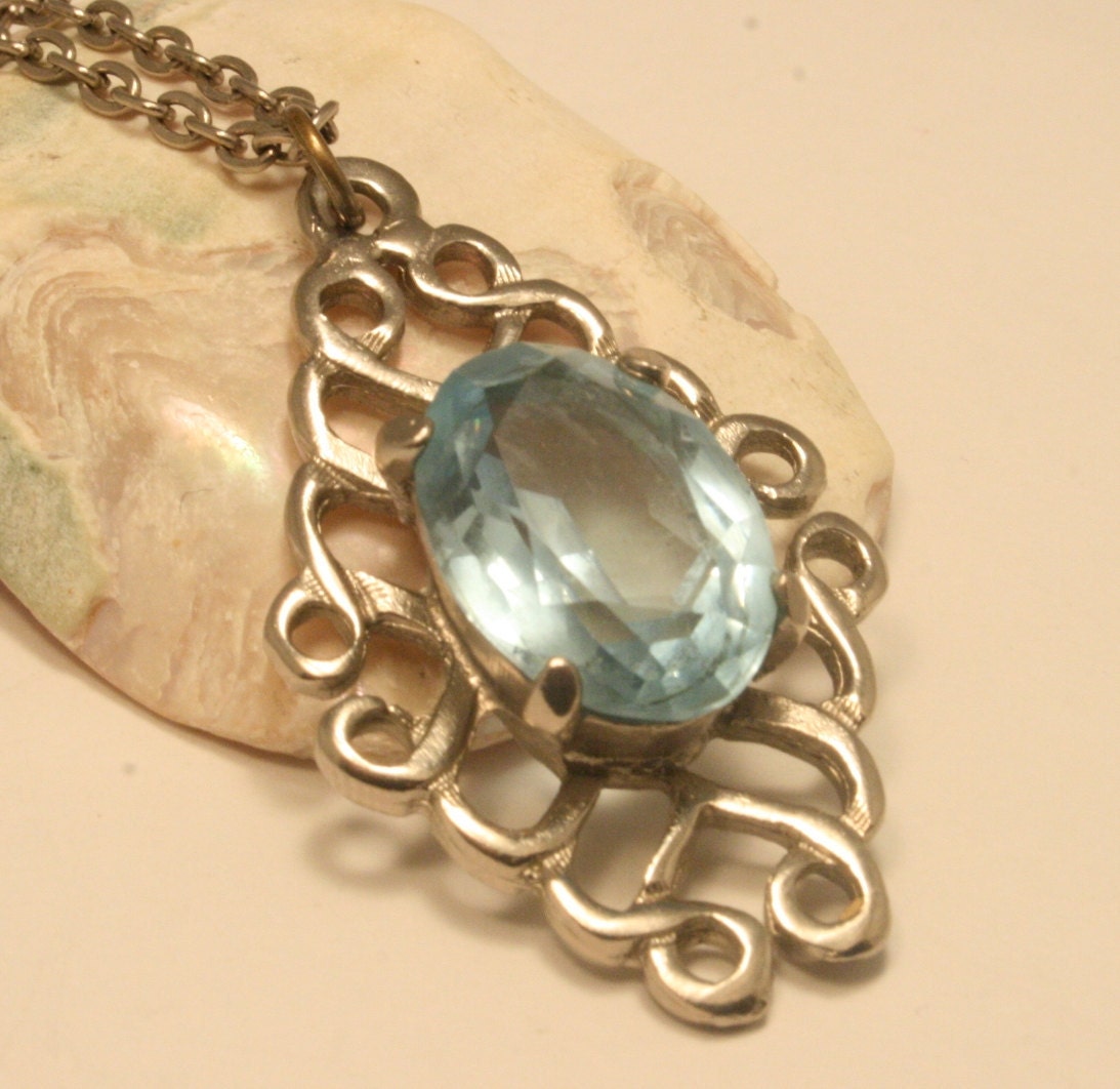 Vintage blue glass pendant. Silverplated Celtic style detail