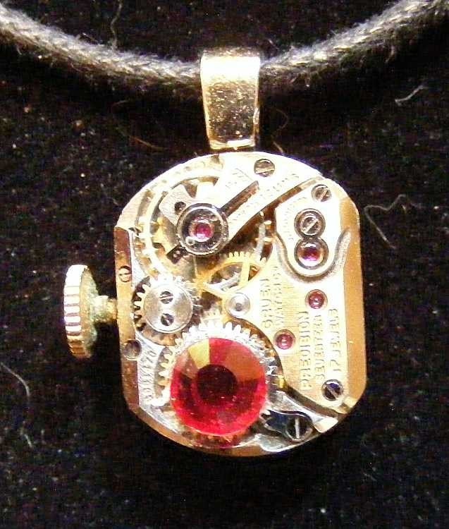 Delicate steampunk watch movement pendant with red stone