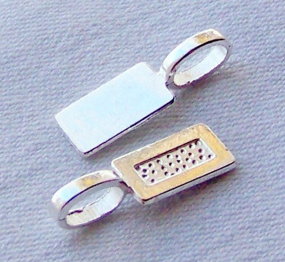 NEW 50 medium sized silver plated rectangular glue on bails... great price