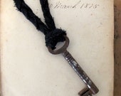 Vintage Skeleton Key with Braided Fabric Necklace. XL. Rust Key and Black Braid.