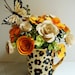 Animal print mug filled with Paper Flowers Mother's Day first anniversary