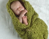 Soft stretchy cocoon from textured wool yarn.