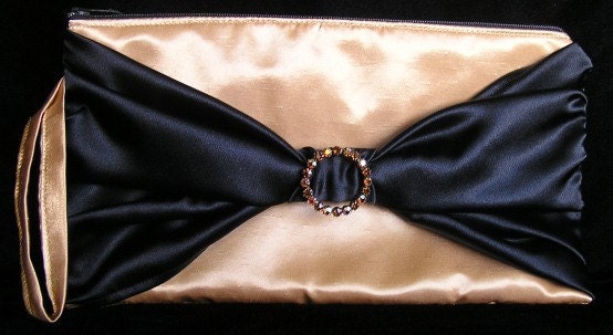 Go for the gold-and-black bowtie clutch
