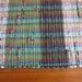 Green Upcycled Rug Woven from Plastic Grocery Bags.