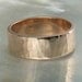 7mm hammered rose gold wedding band, also offered in white gold and yellow gold