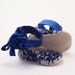 Baby booties in blue rose-appliquéd silk and lace covered leather
