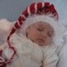 Newborn Handknit Christmas Red Pixie, Munchin, Gnome Hat with White Stripes and White Fur Brim, Cute Baby Gift or Photo Prop