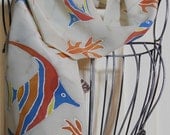 Hand Painted Silk Crepe Scarf in a Tropical Fish and coral pattern on beige, red, blue, orange, and yellow
