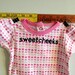 sweetcheeks --- pink patterned onesie, size 3 - 6 months